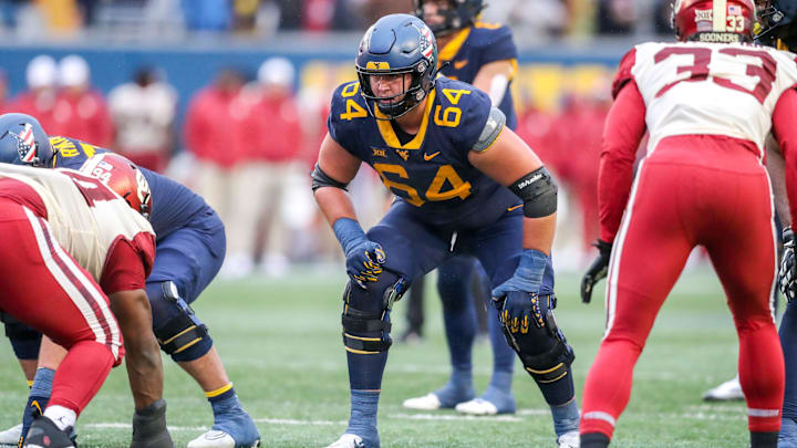 West Virginia Mountaineers offensive lineman Wyatt Milum (64) during the third quarter against the Oklahoma Sooners at Mountaineer Field at Milan Puskar Stadium.