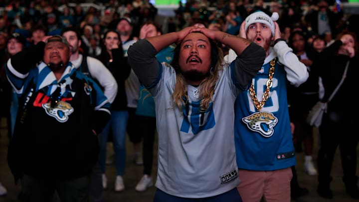 Jacksonville Jaguars fans Erwin Cabling, from left, Griffin Lasch, and Garrett Roberson react. Jacksonville Jaguars fans Erwin Cabling, from left, Griffin Lasch, and Garrett Roberson react.