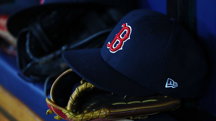 Jul 22, 2019; St. Petersburg, FL, USA; A detail view of Boston Red Sox hat and glove laying in the dugout at Tropicana Field. Mandatory Credit: Kim Klement-Imagn Images Jul 22, 2019; St. Petersburg, FL, USA; A detail view of Boston Red Sox hat and glove laying in the dugout at Tropicana Field. Mandatory Credit: Kim Klement-Imagn Images