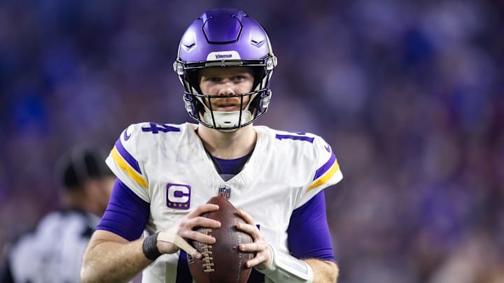 Jan 13, 2025; Glendale, AZ, USA; Minnesota Vikings quarterback Sam Darnold (14) against the Los Angeles Rams during an NFC wild card game at State Farm Stadium. Mandatory Credit: Mark J. Rebilas-Imagn Images