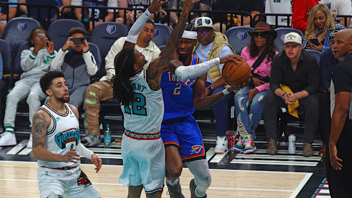 Oklahoma City Thunder guard Shai Gilgeous-Alexander (2) drives to the basket as Memphis Grizzlies guard Ja Morant (12) defends during the first quarter during game three for the first round of the 2024 NBA Playoffs at FedExForum. Mandatory Credit: Petre Thomas-Imagn Images Oklahoma City Thunder guard Shai Gilgeous-Alexander (2) drives to the basket as Memphis Grizzlies guard Ja Morant (12) defends during the first quarter during game three for the first round of the 2024 NBA Playoffs at FedExForum. Mandatory Credit: Petre Thomas-Imagn Images