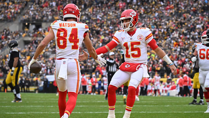 Dec 25, 2024; Pittsburgh, Pennsylvania, USA; Kansas City Chiefs wide receiver Justin Watson (84) celebrates an 11-yard touchdown with quarterback Patrick Mahomes (15)  against the Pittsburgh Steelers during the first quarter at Acrisure Stadium. Mandatory Credit: Barry Reeger-Imagn Images