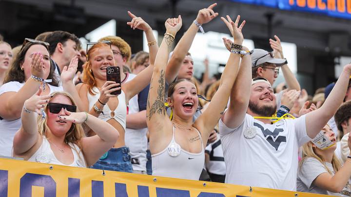 Sep 5, 2026; Morgantown, West Virginia, USA;  West Virginia Mountaineers students cheer after a touchdown during the first quarter against the Coastal Carolina Chanticleers at Milan Puskar Stadium.  Mandatory Credit: Ben Queen-Imagn Images