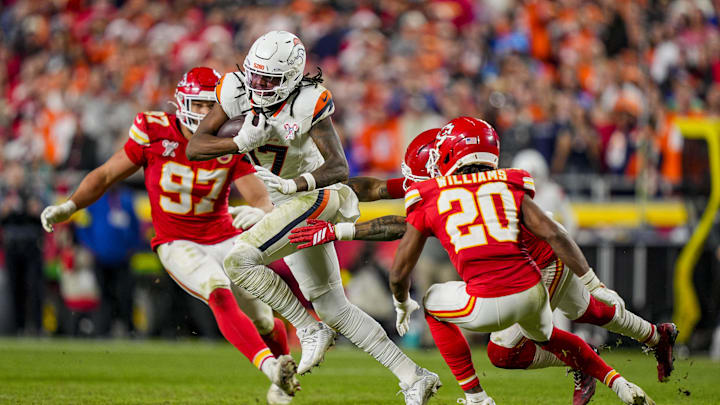 Dec 25, 2025; Kansas City, Missouri, USA; Denver Broncos wide receiver Lil'Jordan Humphrey (17) runs against Kansas City Chiefs cornerback Nohl Williams (20) and Kansas City Chiefs defensive end Ashton Gillotte (97) during the fourth quarter  at GEHA Field at Arrowhead Stadium. Mandatory Credit: Jay Biggerstaff-Imagn Images