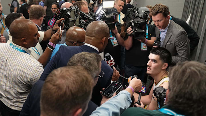 Purdue Boilermakers center Zach Edey (15) answers questions in the locker room Saturday, April 6,