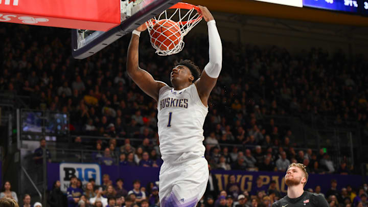 Great Osobor dunks the ball against Purdue at Alaska Airlines Arena.