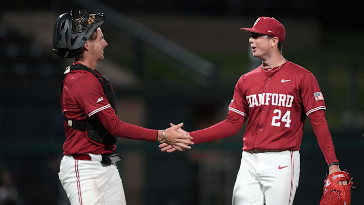 Mar 1, 2025; Stanford, CA, USA; Stanford Cardinal relief pitcher Aidan Keenan (24) is congratulated by catcher Luke Lavin (left) after the last out of the top of the eighth inning against the Xavier Musketeers at Sunken Diamond. Mandatory Credit: Darren Yamashita-Imagn Images Mar 1, 2025; Stanford, CA, USA; Stanford Cardinal relief pitcher Aidan Keenan (24) is congratulated by catcher Luke Lavin (left) after the last out of the top of the eighth inning against the Xavier Musketeers at Sunken Diamond. Mandatory Credit: Darren Yamashita-Imagn Images