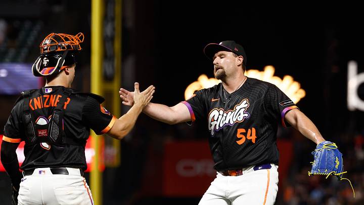 Sep 8, 2026; San Francisco, California, USA; San Francisco Giants relief pitcher Joel Kuhnel (54) celebrates with catcher Andrew Knizner (19) after the game against the St. Louis Cardinals at Oracle Park. Mandatory Credit: Kelley L Cox-Imagn Images