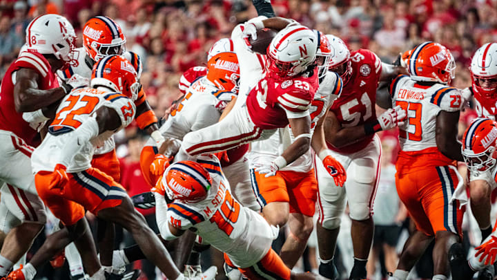 Sep 20, 2024; Lincoln, Nebraska, USA; Nebraska Cornhuskers running back Dante Dowdell (23) is brought down by Illinois Fighting Illini defensive back Miles Scott (10) during the fourth quarter at Memorial Stadium. 