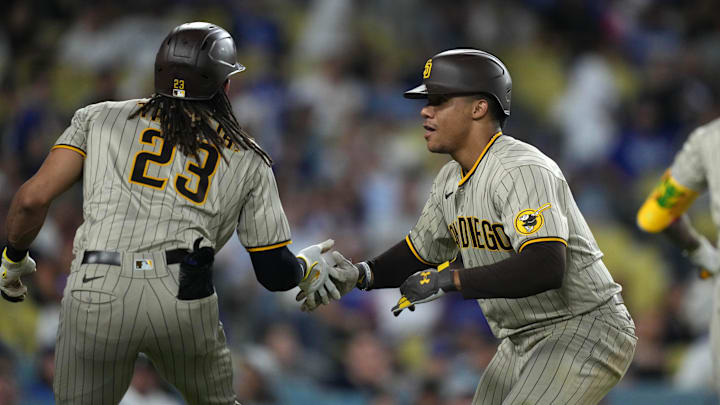 Juan Soto celebrates with right fielder Fernando Tatis Jr. after hitting a three-run home run against the Los Angeles Dodgers