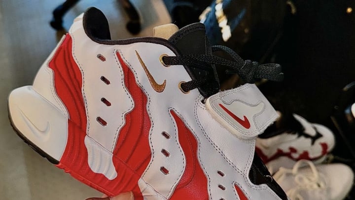 Deion Sanders holds the Nike LeBron 21.