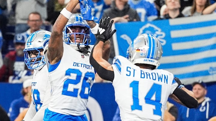 Detroit Lions running back Jahmyr Gibbs (26) celebrates a touchdown with wideout Amon-Ra St. Brown (14) 