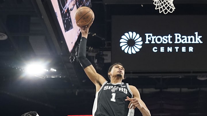 Apr 12, 2024; San Antonio, Texas, USA; San Antonio Spurs forward Victor Wembanyama (1) goes up to