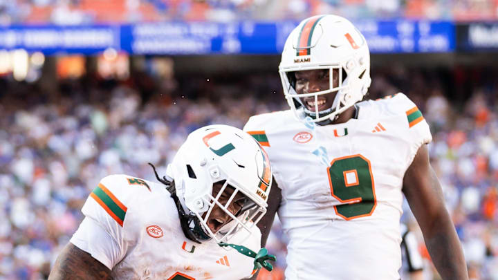 Aug 31, 2024; Gainesville, Florida, USA; Miami Hurricanes running back Mark Fletcher Jr. (4) and Miami Hurricanes tight end Elija Lofton (9) celebrate after a touchdown against the Florida Gators during the second half at Ben Hill Griffin Stadium. Mandatory Credit: Matt Pendleton-Imagn Images