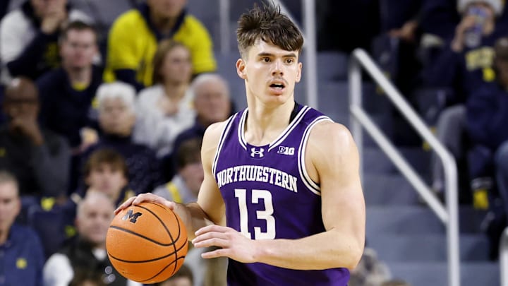 Jan 19, 2025; Ann Arbor, Michigan, USA;  Northwestern Wildcats guard Brooks Barnhizer (13) dribbles in the second half against the Michigan Wolverines at Crisler Center. Mandatory Credit: Rick Osentoski-Imagn Images