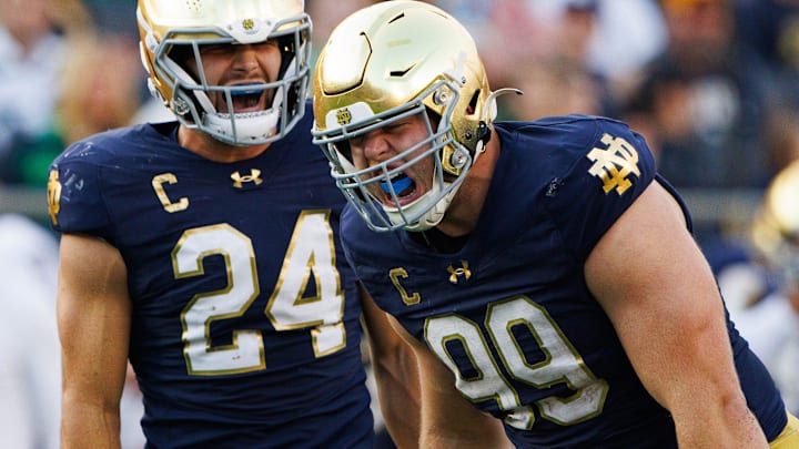 Notre Dame defensive lineman Rylie Mills (99) and linebacker Jack Kiser (24) celebrate a sack by Mills during a NCAA college football game between Notre Dame and Stanford at Notre Dame Stadium on Saturday, Oct. 12, 2024, in South Bend.