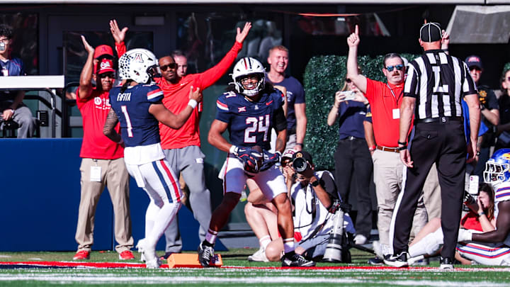 Nov 8, 2025; Tucson, Arizona, USA; Arizona Wildcats running back Quincy Craig (24) scores a touchdown during the second quarter of the game against the Kansas Jayhawks at Arizona Stadium. Mandatory Credit: Aryanna Frank-Imagn Images
