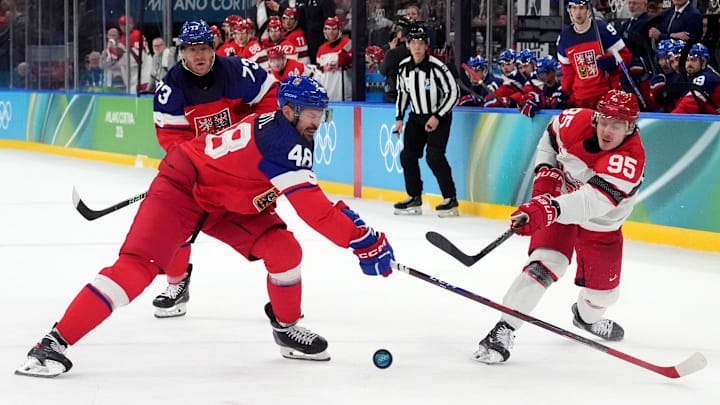 Feb 17, 2026; Milan, Italy; Tomas Hertl of Czech Republic in action with Nick Olesen of Denmark during a men's ice hockey qualification playoff game during the Milano Cortina 2026 Olympic Winter Games at Milano Santagiulia Ice Hockey Arena. Mandatory Credit: Amber Searls-Imagn Images Feb 17, 2026; Milan, Italy; Tomas Hertl of Czech Republic in action with Nick Olesen of Denmark during a men's ice hockey qualification playoff game during the Milano Cortina 2026 Olympic Winter Games at Milano Santagiulia Ice Hockey Arena. Mandatory Credit: Amber Searls-Imagn Images