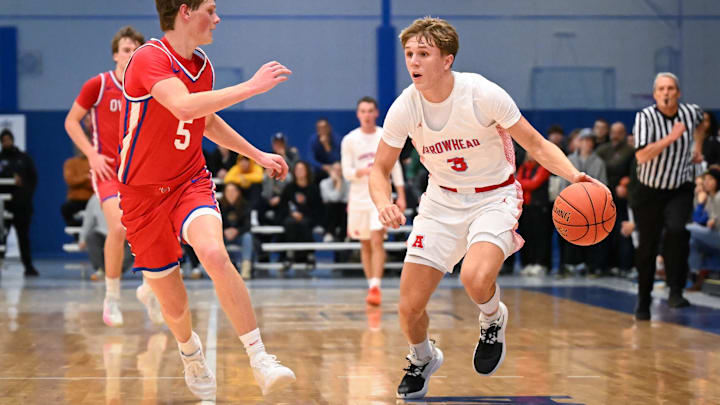 Arrowhead guard Trey Resch (3) handles the ball against Slinger guard Bryson Fogle (5) in the Rick Majerus WBY Shootout on Saturday, December 27, 2025.