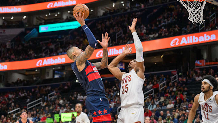 Oct 26, 2024; Washington, District of Columbia, USA; Washington Wizards forward Kyle Kuzma (33) takes a shot over Cleveland Cavaliers forward Isaac Okoro (35) during the second quarter at Capital One Arena. Oct 26, 2024; Washington, District of Columbia, USA; Washington Wizards forward Kyle Kuzma (33) takes a shot over Cleveland Cavaliers forward Isaac Okoro (35) during the second quarter at Capital One Arena.
