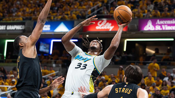 May 9, 2025; Indianapolis, Indiana, USA: Indiana Pacers center Myles Turner (33) shoots the ball while Cleveland Cavaliers forward Evan Mobley (4) defends during game three of the second round for the 2025 NBA Playoffs at Gainbridge Fieldhouse. Mandatory Credit: Trevor Ruszkowski-Imagn Images