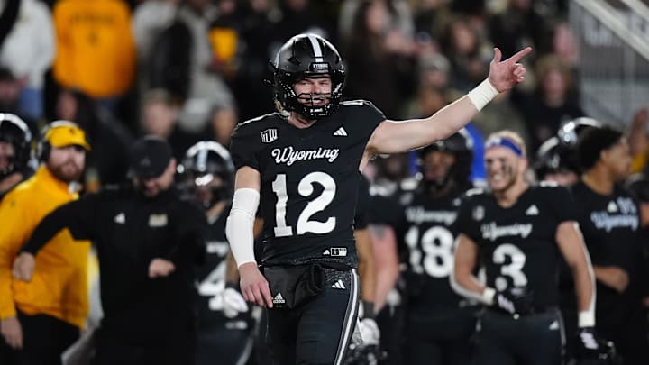 Oct 25, 2025; Laramie, Wyoming, USA; Wyoming Cowboys quarterback Kaden Anderson (12) celebrates a turnover on downs by the Colorado State Rams during the fourth quarter at Jonah Field at War Memorial Stadium. Oct 25, 2025; Laramie, Wyoming, USA; Wyoming Cowboys quarterback Kaden Anderson (12) celebrates a turnover on downs by the Colorado State Rams during the fourth quarter at Jonah Field at War Memorial Stadium.