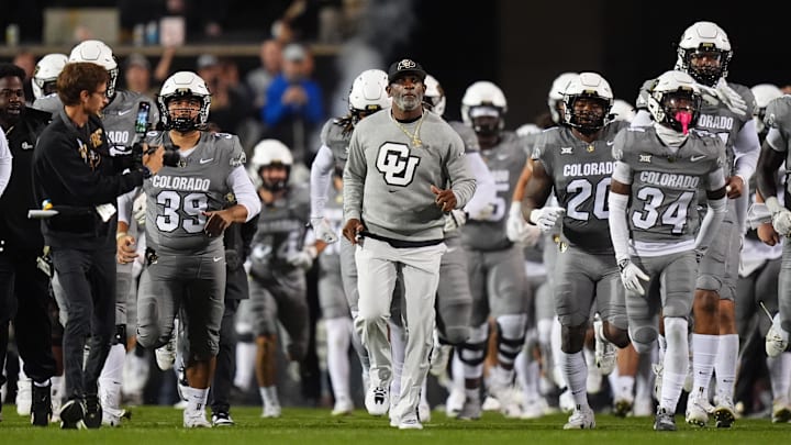 Oct 26, 2024; Boulder, Colorado, USA; Colorado Buffaloes head coach Deion Sanders leads out the team before the game against the Cincinnati Bearcats at Folsom Field. Mandatory Credit: Ron Chenoy-Imagn Images Oct 26, 2024; Boulder, Colorado, USA; Colorado Buffaloes head coach Deion Sanders leads out the team before the game against the Cincinnati Bearcats at Folsom Field. Mandatory Credit: Ron Chenoy-Imagn Images