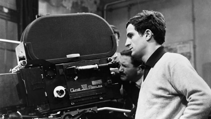 Director Francois Truffaut Beside Movie Camera