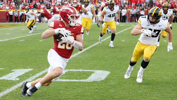 Sep 6, 2025; Ames, Iowa, USA; Iowa State Cyclones running back Carson Hansen (26) runs with the ball against the Iowa Hawkeyes during the second half at Jack Trice Stadium.