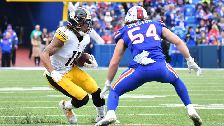 Oct 9, 2022; Orchard Park, New York, USA; Pittsburgh Steelers wide receiver Chase Claypool (11) runs with the ball against Buffalo Bills linebacker Baylon Spector (54) after a catch in the fourth quarter at Highmark Stadium. Mandatory Credit: Mark Konezny-USA TODAY Sports