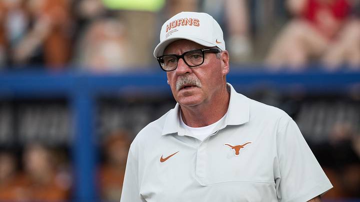 Texas Longhorns head coach Mike White walks to the coaches box in the seventh inning against the Mississippi State Bulldogs. Texas Longhorns head coach Mike White walks to the coaches box in the seventh inning against the Mississippi State Bulldogs.