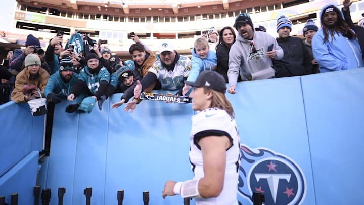 Nov 30, 2025; Nashville, Tennessee, USA;  Jacksonville Jaguars quarterback Trevor Lawrence (16) high fives fans following a game against the Tennessee Titans at Nissan Stadium. Mandatory Credit: Steve Roberts-Imagn Images