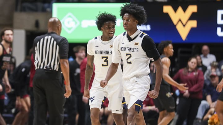 Nov 17, 2025; Morgantown, West Virginia, USA; West Virginia Mountaineers guard Honor Huff (3) celebrates with West Virginia Mountaineers guard Amir Jenkins (2) during the second half against the Lafayette Leopards at WVU Coliseum. Mandatory Credit: Ben Queen-Imagn Images