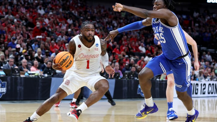 Mar 29, 2024; Dallas, TX, USA; Houston Cougars guard Jamal Shead (1) twists his right ankle driving against Duke Blue Devils forward Mark Mitchell (25) during the first half in the semifinals of the South Regional of the 2024 NCAA Tournament at American Airlines Center. Mandatory Credit: Tim Heitman-USA TODAY Sports 