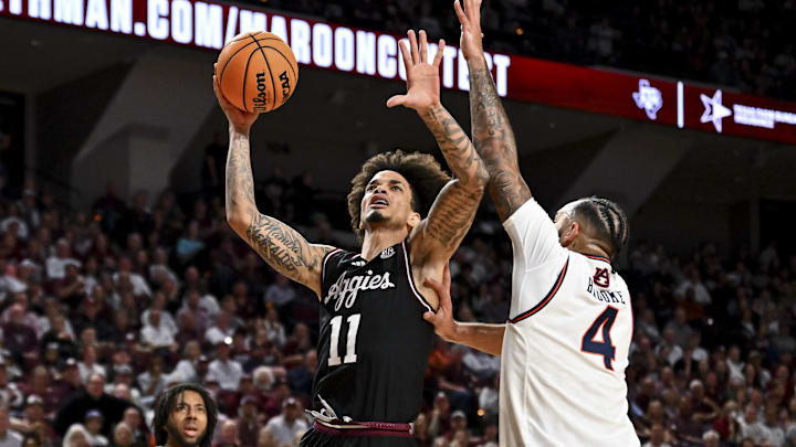Mar 4, 2025; College Station, Texas, USA; Texas A&M Aggies forward Andersson Garcia (11) shoots the ball as Auburn Tigers forward Johni Broome (4) defends during the first half at Reed Arena. Mandatory Credit: Maria Lysaker-Imagn Images Mar 4, 2025; College Station, Texas, USA; Texas A&M Aggies forward Andersson Garcia (11) shoots the ball as Auburn Tigers forward Johni Broome (4) defends during the first half at Reed Arena. Mandatory Credit: Maria Lysaker-Imagn Images