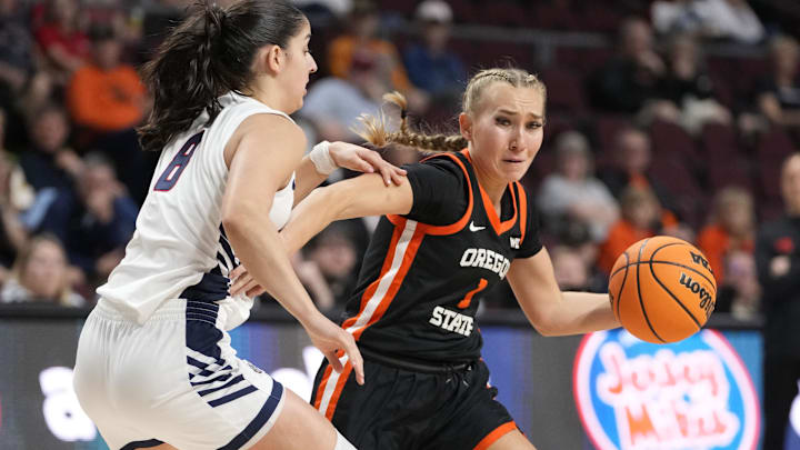 March 10, 2025; Las Vegas, NV, USA; Oregon State Beavers guard Kennedie Shuler (1) dribbles the basketball against Gonzaga Bulldogs guard Ines Bettencourt (8) during the first half in the semifinal of the West Coast Conference tournament at Orleans Arena. Mandatory Credit: Kyle Terada-Imagn Images