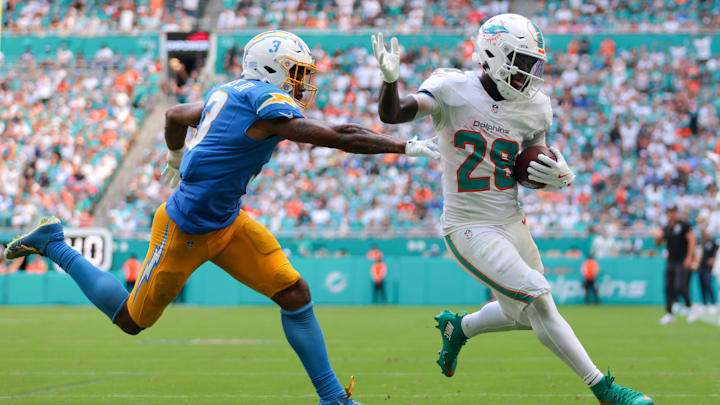Oct 12, 2025; Miami Gardens, Florida, USA; Miami Dolphins running back De'Von Achane (28) carries the football for a touchdown against Los Angeles Chargers free safety Derwin James (3) during the fourth quarter at Hard Rock Stadium. Mandatory Credit: Sam Navarro-Imagn Images Oct 12, 2025; Miami Gardens, Florida, USA; Miami Dolphins running back De'Von Achane (28) carries the football for a touchdown against Los Angeles Chargers free safety Derwin James (3) during the fourth quarter at Hard Rock Stadium. Mandatory Credit: Sam Navarro-Imagn Images