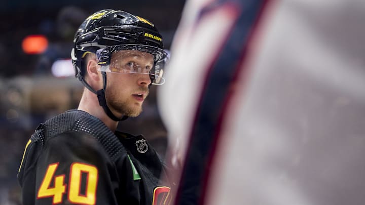 Jan 27, 2023; Vancouver, British Columbia, CAN; Vancouver Canucks forward Elias Pettersson (40) looks at Columbus Blue Jackets forward Sean Kuraly (7) after a scrum in the second period at Rogers Arena. Mandatory Credit: Bob Frid-Imagn Images