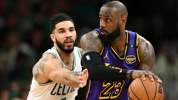 Mar 8, 2025; Boston, Massachusetts, USA; Los Angeles Lakers forward LeBron James (23) controls the ball against Boston Celtics forward Jayson Tatum (0) during the fourth quarter at the TD Garden. Mandatory Credit: Brian Fluharty-Imagn Images