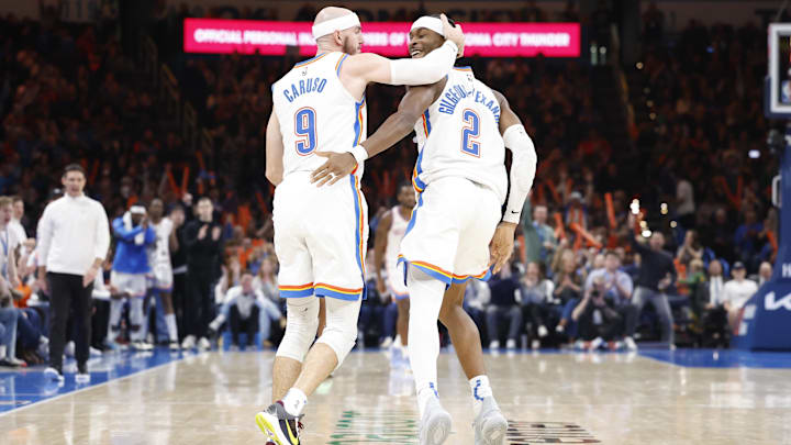 Dec 23, 2024; Oklahoma City, Oklahoma, USA;Oklahoma City Thunder guard Alex Caruso (9) and guard Shai Gilgeous-Alexander (2) celebrate after a play against the Washington Wizards during the second half at Paycom Center. Mandatory Credit: Alonzo Adams-Imagn Images
