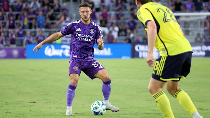 May 21, 2025; Orlando, Florida, USA; Orlando City forward Marco Pasalic (87) dribbles against the Nashville SC during the first half at Inter&Co Stadium. Mandatory Credit: Kim Klement Neitzel-Imagn Images