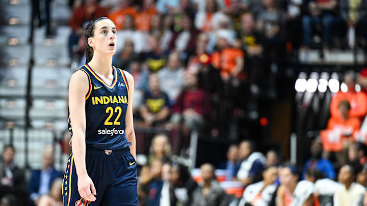 Sep 22, 2024; Uncasville, Connecticut, USA; Indiana Fever guard Caitlin Clark (22) looks at the video board in the fourth quarter against Connecticut Sun during game one of the first round of the 2024 WNBA Playoffs at Mohegan Sun Arena. Mandatory Credit: Mark Smith-Imagn Images Sep 22, 2024; Uncasville, Connecticut, USA; Indiana Fever guard Caitlin Clark (22) looks at the video board in the fourth quarter against Connecticut Sun during game one of the first round of the 2024 WNBA Playoffs at Mohegan Sun Arena. Mandatory Credit: Mark Smith-Imagn Images
