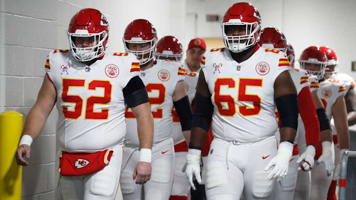 Dec 25, 2024; Pittsburgh, Pennsylvania, USA;  Kansas City Chiefs center Creed Humphrey (52) and guard Trey Smith (65) walk to the field to warm up against the Pittsburgh Steelers at Acrisure Stadium. Mandatory Credit: Charles LeClaire-Imagn Images