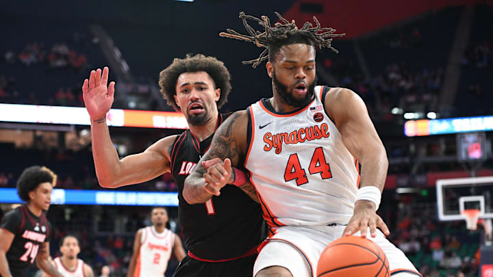 Jan 14, 2025; Syracuse, New York, USA; Syracuse Orange center Eddie Lampkin Jr. (44) challenge each other on the base line Louisville Cardinals guard J'Vonne Hadley (1) in the second half at the JMA Wireless Dome. Mandatory Credit: Mark Konezny-Imagn Images Jan 14, 2025; Syracuse, New York, USA; Syracuse Orange center Eddie Lampkin Jr. (44) challenge each other on the base line Louisville Cardinals guard J'Vonne Hadley (1) in the second half at the JMA Wireless Dome. Mandatory Credit: Mark Konezny-Imagn Images