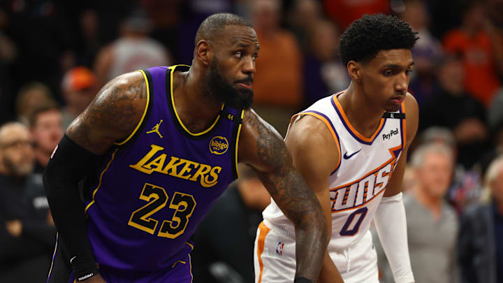 Oct 28, 2024; Phoenix, Arizona, USA; Los Angeles Lakers forward LeBron James (23) against Phoenix Suns forward Ryan Dunn (0) at Footprint Center. Mandatory Credit: Mark J. Rebilas-Imagn Images