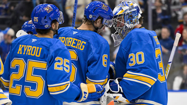 Mar 22, 2025; St. Louis, Missouri, USA;  St. Louis Blues goaltender Joel Hofer (30) and defenseman Philip Broberg (6) celebrate after the Blues defeated the Chicago Blackhawks at Enterprise Center. Mandatory Credit: Jeff Curry-Imagn Images