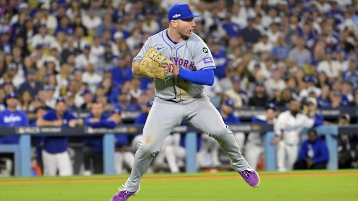 Oct 20, 2024; Los Angeles, California, USA; New York Mets first baseman Pete Alonso (20) fields the ball hit by Los Angeles Dodgers second baseman Chris Taylor (not pictured) in the sixth inning during game six of the NLCS for the 2024 MLB playoffs at Dodger Stadium. Mandatory Credit: Jayne Kamin-Oncea-Imagn Images
