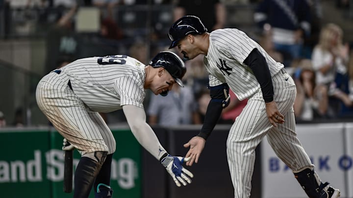 Aug 24, 2025; Bronx, New York, USA; New York Yankees outfielder Trent Grisham (12) celebrates with outfielder Aaron Judge (99) after hitting his second home run of the game against the Boston Red Sox during the fifth inning at Yankee Stadium. Mandatory Credit: John Jones-Imagn Images