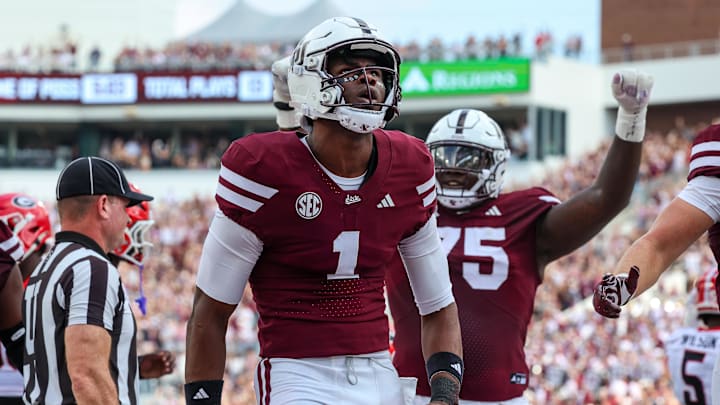 Nov 8, 2025; Starkville, Mississippi, USA; Mississippi State Bulldogs quarterback Kamario Taylor (1) reacts after a touchdown against the Georgia Bulldogs during the first half at Davis Wade Stadium at Scott Field. Mandatory Credit: Wesley Hale-Imagn Images