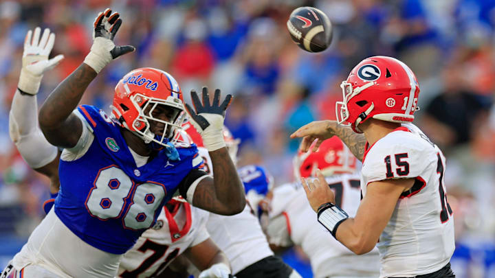 Florida's Caleb Banks applies the pressure to Carson Beck in a playoff game. Florida's Caleb Banks applies the pressure to Carson Beck in a playoff game.